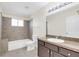 Bathroom with tub, toilet, and vanity at 2317 Prime Cir # B, Kissimmee, FL 34746