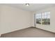 Bright bedroom with large window and carpet at 2317 Prime Cir # B, Kissimmee, FL 34746