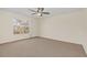 Spacious bedroom with carpeted floor and ceiling fan at 2317 Prime Cir # B, Kissimmee, FL 34746