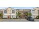 Two-story condo building with parking and landscaping at 2317 Prime Cir # B, Kissimmee, FL 34746