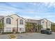 Two-story condo building with parking and tropical landscaping at 2317 Prime Cir # B, Kissimmee, FL 34746
