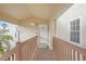 Private condo entry with wooden railings at 2317 Prime Cir # B, Kissimmee, FL 34746
