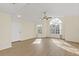 Bright living room with laminate floors and arched window at 2317 Prime Cir # B, Kissimmee, FL 34746