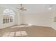 Spacious living room featuring a large window and hardwood floors at 2317 Prime Cir # B, Kissimmee, FL 34746