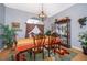 Bright dining room features a formal table, chandelier, and decorative rug at 2355 Barratt Ct, St Cloud, FL 34771