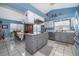 Kitchen with gray cabinets, island, and stainless steel appliances at 2355 Barratt Ct, St Cloud, FL 34771