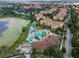 Aerial view of resort-style community featuring a large pool, water slides, and well-maintained landscaping at 2615 Pawnall St, Kissimmee, FL 34747