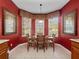 Breakfast nook with large windows and a table set for dining at 2615 Pawnall St, Kissimmee, FL 34747