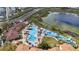 An aerial view showcasing a beautiful community pool and water park area at 2615 Pawnall St, Kissimmee, FL 34747