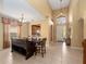Open-concept home with a dining table and a clear view of the front door at 2615 Pawnall St, Kissimmee, FL 34747