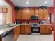 Well-equipped kitchen featuring stainless steel appliances and granite countertops at 2615 Pawnall St, Kissimmee, FL 34747