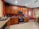Well-equipped kitchen featuring stainless steel appliances and granite countertops at 2615 Pawnall St, Kissimmee, FL 34747