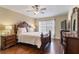 Main bedroom with large bed, dresser, and ceiling fan at 3001 Laurel Park Ln # 304, Kissimmee, FL 34741