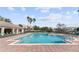 Large community pool with plenty of lounge chairs at 3001 Laurel Park Ln # 304, Kissimmee, FL 34741