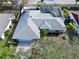 Aerial view of house with pool and landscaped yard at 31 Augusta Cir, St Cloud, FL 34769