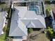 Aerial view of house, showing the roof, pool, and backyard at 31 Augusta Cir, St Cloud, FL 34769