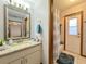 Bathroom with granite countertop, tub, and shower at 31 Augusta Cir, St Cloud, FL 34769