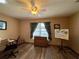 Spacious bedroom with a dresser, window seat, and view of the water at 31 Augusta Cir, St Cloud, FL 34769