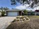 Single-story home with a paved driveway and landscaped front yard at 31 Augusta Cir, St Cloud, FL 34769