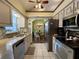 Bright kitchen with granite countertops and stainless steel appliances at 31 Augusta Cir, St Cloud, FL 34769