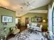 Bright living room with vaulted ceiling, comfy seating, and large window at 31 Augusta Cir, St Cloud, FL 34769