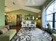 Living room with vaulted ceilings and a beige couch at 31 Augusta Cir, St Cloud, FL 34769