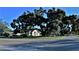 Quiet residential street lined with mature trees and homes at 31 Augusta Cir, St Cloud, FL 34769