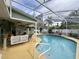 Large screened-in pool with a patio and plenty of seating at 31 Augusta Cir, St Cloud, FL 34769