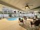 Inviting screened-in pool and patio area with seating at 31 Augusta Cir, St Cloud, FL 34769