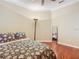 Bedroom with a full bed, wood floors, and a full-length mirror at 3228 Abalone Blvd, Orlando, FL 32833