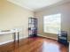Well-lit bedroom featuring wood floors and ample storage at 3228 Abalone Blvd, Orlando, FL 32833