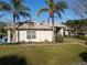 Single story home with metal roof and palm trees at 3228 Abalone Blvd, Orlando, FL 32833