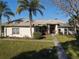 One-story house with metal roof and manicured lawn at 3228 Abalone Blvd, Orlando, FL 32833