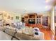 Cozy Gathering room featuring hardwood floors, built-in shelving, and comfortable seating at 3228 Abalone Blvd, Orlando, FL 32833