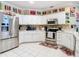 Modern kitchen with stainless steel appliances and white cabinets at 3228 Abalone Blvd, Orlando, FL 32833