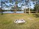 Serene lakefront lot with fire pit, offering peaceful views and ample space at 3228 Abalone Blvd, Orlando, FL 32833
