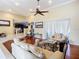 Spacious living room with hardwood floors, a view of the kitchen, and comfortable seating at 3228 Abalone Blvd, Orlando, FL 32833