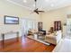 Light-filled living room featuring hardwood floors and comfortable seating at 3228 Abalone Blvd, Orlando, FL 32833
