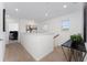 Bright, carpeted upstairs landing with white walls, staircase, and modern decor, connecting the upper level spaces at 332 Pink Ibis Bnd, St Cloud, FL 34772