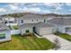 Two-story house, backyard, and neighborhood view at 332 Pink Ibis Bnd, St Cloud, FL 34772