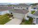Two-story house with a two-car garage and driveway at 332 Pink Ibis Bnd, St Cloud, FL 34772