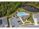 Aerial view of community pool, playground, and parking at 332 Pink Ibis Bnd, St Cloud, FL 34772