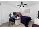 Bedroom with a double bed, desk setup, and ceiling fan at 332 Pink Ibis Bnd, St Cloud, FL 34772