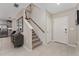 Bright entryway with stairs and view to kitchen at 332 Pink Ibis Bnd, St Cloud, FL 34772