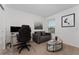 Bright home office features a desk, chair, and comfy couch at 332 Pink Ibis Bnd, St Cloud, FL 34772