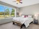 Main bedroom with large window, plush bed, and carpeted floor at 336 Del Sol Ave, Davenport, FL 33837