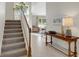 Bright and spacious entryway with hardwood floors and a staircase at 336 Del Sol Ave, Davenport, FL 33837
