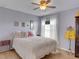 Cozy guest bedroom with a comfortable queen-size bed and decorative pillows at 336 Del Sol Ave, Davenport, FL 33837