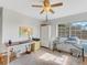Home office with desk, storage, and window overlooking backyard at 336 Del Sol Ave, Davenport, FL 33837
