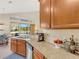 Kitchen boasts granite countertops, modern sink, and view to backyard at 336 Del Sol Ave, Davenport, FL 33837